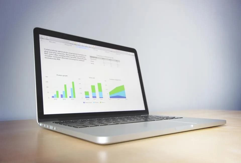 A laptop showing charts and structured data
